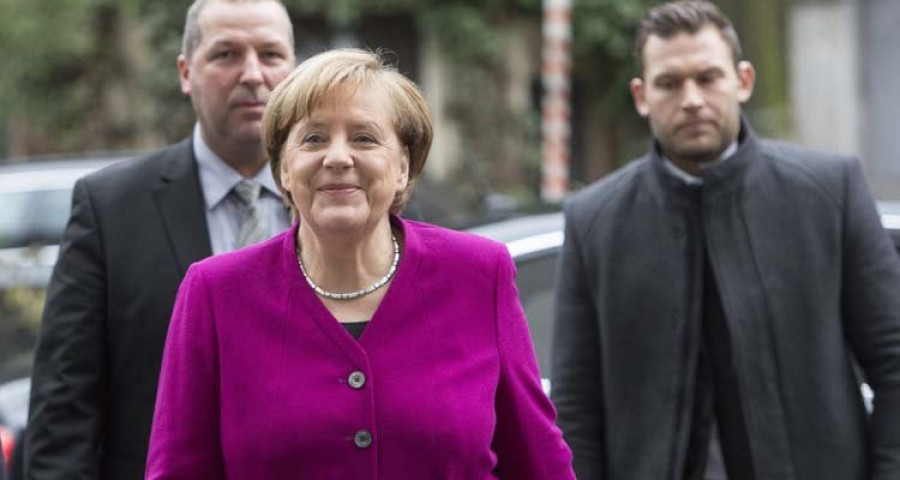 Merkel y Schulz inician optimistas las reuniones para formar gobierno