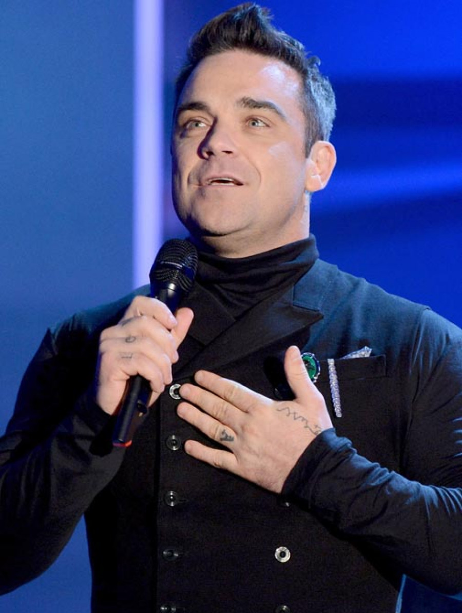 Un feliz Robbie Williams enciende las luces navideñas en el centro de Londres