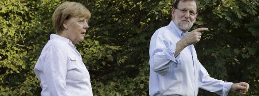 Rajoy y Merkel analizan la crisis migratoria al inicio de su cumbre