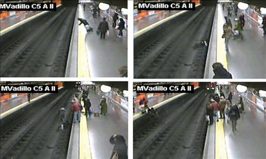 Un policía evita que el metro arrolle a una mujer que cayó a la vía en Madrid